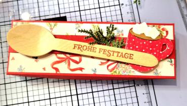 Ein Wohlfühlset "Heiße Schokolade mit Schokopulver, einer Schokolade und Chamallows Minis" Mitbringsel